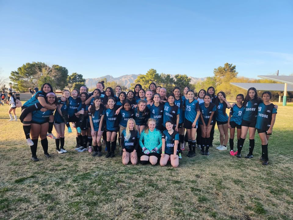 Dodge girls soccer team on the field